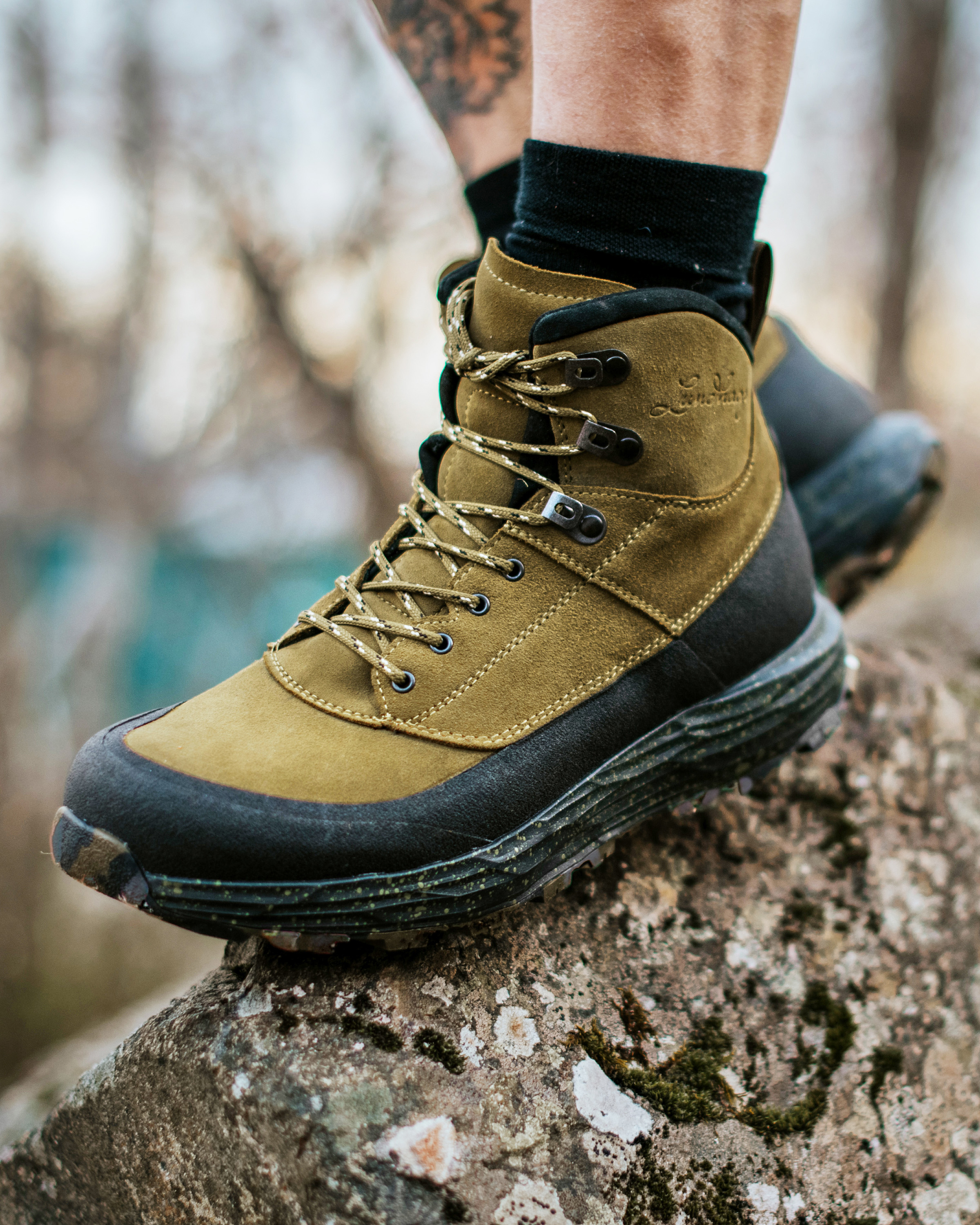 Lundhags hiking boots on mountain trail showcasing Swedish outdoor footwear excellence